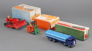 Dinky Toys, a Super Toys Foden 14-Ton tanker 1504, a Super Toys Blaw Knox bulldozer 561 and a Coventry Climax forklift truck 14C, all boxed 