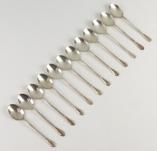 Twelve silver coffee spoons with fancy handles, Birmingham 1962, 77 grams