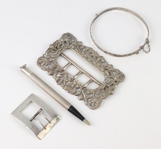 A Victorian cast silver buckle, 1 other, a bangle and a propelling pencil 