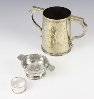 A Victorian silver plated twin handled trophy cup 15cm, a silver plated quaich 12cm and a ditto napkin ring  