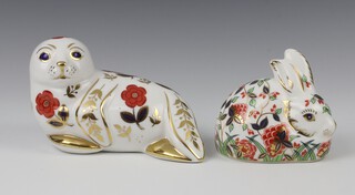 Two Royal Crown Derby Imari pattern paperweights - seal cub with silver stopper 15cm and Meadow Rabbit with gold stopper 9cm 