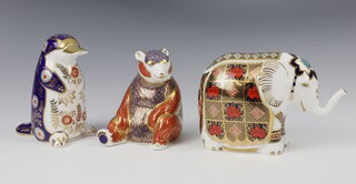 Three Royal Crown Derby Imari pattern paperweights - duck billed platypus with gold stopper 12cm, honey bear gold stopper 10cm and elephant gold stopper 15cm 