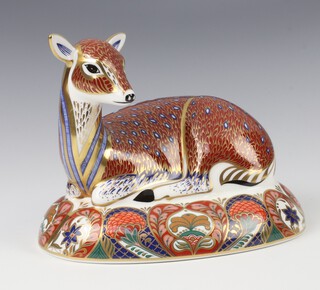 A Royal Crown Derby Imari pattern paperweight of a  deer with gold stopper 17cm  