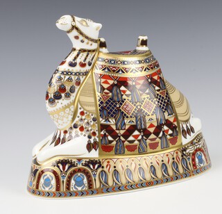 A Royal Crown Derby Imari pattern paperweight of a reclining camel by John Abbitt with gold stopper 20cm 