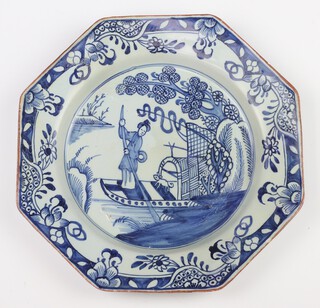 An 18th Century Bristol Delft octagonal plate decorated with a figure and dog on a boat enclosed by a floral border 21cm 