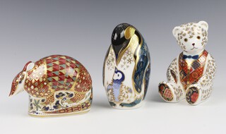 Three Royal Crown Derby Imari pattern paperweights - armadillo  12cm, teddybear with waistcoat  11cm and penguin and chick 12cm, all with silver stoppers 