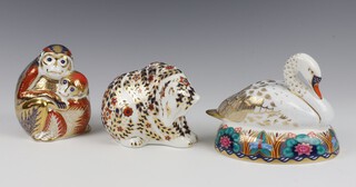 Three Royal Crown Derby Imari pattern paperweights - monkey and baby with 10cm, bear cub 10cm both with silver stoppers and and swan gold stopper 10cm 