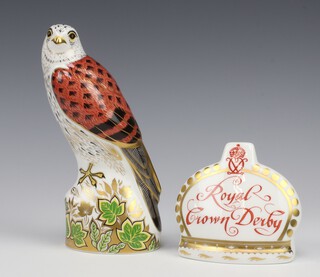 A Royal Crown Derby Imari pattern  paperweight of a Kestrel with gold stopper 19cm, boxed together with a ditto name stand with gold stopper 9cm boxed 