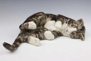 A Jenny Winstanley ceramic figure of a cat with glass eyes lying down no.8, 45cm 