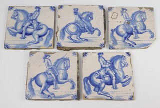 A set of 5 18th Century Dutch Delft tiles depicting figures on horseback with floral corners 15cm x 15cm 