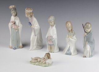 A Lladro Nativity set comprising The Infant Christ, kneeling Mary, Three Wise Men and seated shepherd 