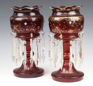 A pair of Victorian ruby glass lustres with gilt and polychrome decoration having faceted drops 31cm 