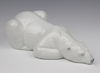 A Lladro figure of a reclining polar bear 8410 32cm 