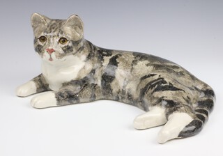 A Jenny Winstanley ceramic figure of a reclining cat with glass eyes no.7, 37cm 