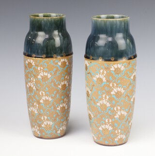 A pair of Doulton Silica vases decorated with flowers 22cm 