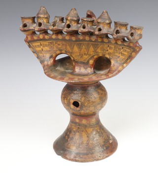 A 19th Century  South American Earthenware table oil lamp with 8 receptacles, centre dish and baluster vase with geometric decoration 34cm 