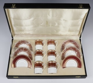 A cased set of 6 Royal Doulton Buckingham pattern coffee cans and saucers, boxed