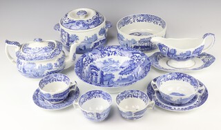 A matched set of Spode Italian garden dinner ware comprising 2 large plates, 10 dinner plates, 2 medium plates, 9 side plates, 3 vegetable dishes, a rectangular dish, a fruit bowl, a deep bowl, a casserole and cover, 4 serving plates, teapot and lid, milk jug, sugar bowl, sauce boat and stand, 6 tea cups, 6 saucers, 5 two handled bowls and 10 saucers 