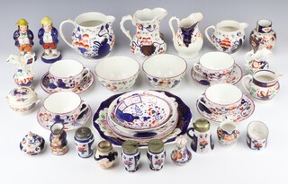 A quantity of matched Victorian lustre tea ware comprising 2 milk jugs, 2 cream jugs, 2 sugar bowls, 4 tea cups and 4 saucers, 3 plates, 4 jugs, vase, saucer, cake plate and minor items 