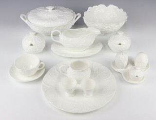 A matched Wedgwood and Coalport Country ware tea and dinner service comprising 7 large tea cups (1 a/f), 8 saucers (1 a/f), 8 dinner plates, 2 medium plates, 8 side plates, 8 small plates, 6 fruit bowls (1 a/f), 4 dessert bowls, 4 egg cups, 2 side dishes, 4 avocado dishes (1 a/f), small sauce boat and stand, a milk jug, 4 tureen lids (2 a/f), 1 small tea cup, a serving platter, 3 small bowls, a small tureen and cover, 2 preserve pots and lids (1 lid a/f), a 4 piece condiment, fruit bowl, large sauce boat and stand, 2 large tureens and covers (1 tureen chipped)