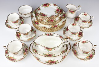 A 34 piece Royal Albert Old Country Rose pattern dinner/tea service comprising 6 dinner plates (all seconds), 6 side plates, 6 tea plates, twin handled plate, sauce boat and stand (stand is a second), sugar bowl, cream jug, 6 cups and 6 saucers 