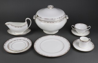 A 118 piece Wedgwood Colchester pattern dinner, tea and coffee service comprising, twin handled vegetable tureen and cover, 2 oval tureens and covers, 12 dinner plates, 12 side plates, 12 bowls, 12 tea plates, 2 sauce boats and stands, oval platter, oval meat plate, oval bread plate, circular bowl, 2 oval dishes (chip to edge), 4 circular bowls, rectangular plate (cracked), 2 small dishes, 12 twin handled soup bowls and saucers, coffee pot, twin handled sugar bowl, cream jug, 12 coffee cans, 13 saucers