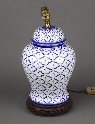 A modern Chinese baluster  table lamp on a wooden stand 36cm 