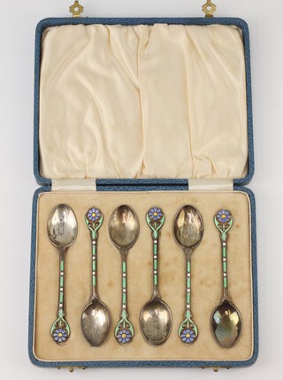 A set of 6 silver and enamelled teaspoons with floral handles Birmingham 1931, maker William Hutton and Sons Ltd, 49 grams 