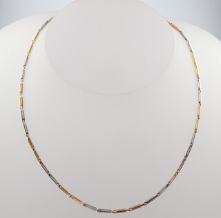 A yellow and white gold Albert, tested as 18ct, 33cm, 8.9 grams 