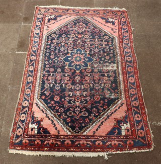 A blue, pink and white ground Persian carpet with diamond medallion to the centre 203cm x 133cm 