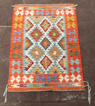 An orange, green and turquoise ground Chobi Kilim rug 122cm x 80cm 