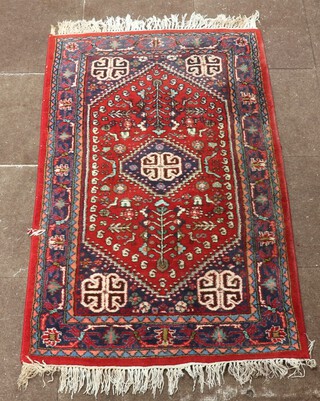 A red and blue ground Persian rug with diamond medallion to the centre within a multi row border, 160cm x 93cm 