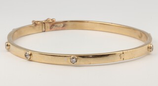 A yellow gold 9ct diamond set bangle 6.1 grams 