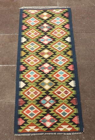 A green, black and white ground Maimana Kilim runner with all over diamond design 184cm x 68cm 