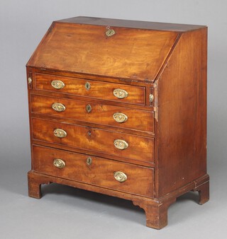 A Georgian mahogany bureau, the fall front revealing a fitted interior above 3 long graduated drawers with replacement drop handles, raised on bracket feet 103cm h x 91cm w x 51cm d