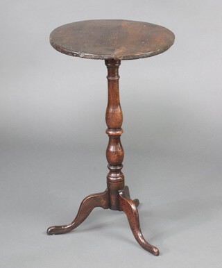 An 18/19th Century turned oak wine table on pillar and tripod base 70cm h x 40cm diam. 