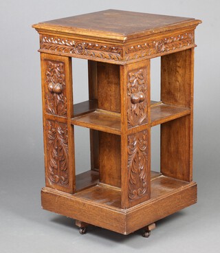 A Victorian square carved oak 2 tier revolving bookcase decorated fruit 88cm h x 51cm w x 50cm d  