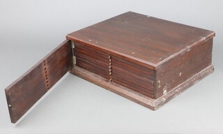 A 19th Century rectangular mahogany coin collectors chest of 9 drawers enclosed by a panelled door 12cm h x 34cm w x 29cm d 