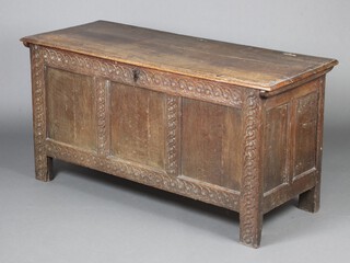 A 17th Century carved oak coffer with hinged lid, fitted candle box to the interior and with original pin hinges 68cm h x 138cm w x 54cm d 