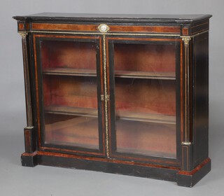 A Victorian ebonised and walnut display cabinet with gilt metal mounts, fitted a cupboard with shelves enclosed by glazed panelled doors and with columns to the sides 100cm h x 121cm w 97cm d 