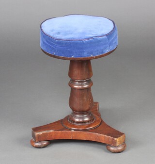 A William IV revolving adjustable piano stool raised on turned column, triform base and bun feet 47cm h x 30cm diam. 