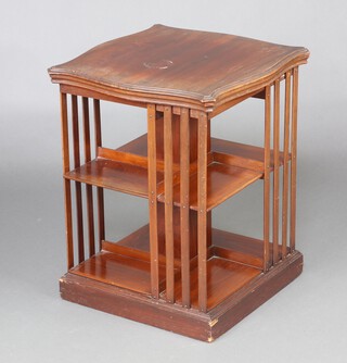 An Edwardian square and serpentine outline, 2 tier (ex revolving) bookcase 66cm h x 53cm w x 53cm d 