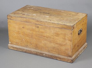 A Victorian pine carpenter's trunk with hinged lid and iron drop handles, the interior fitted a candle box above 2 recesses, 52cm h x 99cm w x 54cm d 