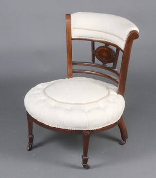 A Victorian inlaid mahogany bar back nursing chair, the oval seat and back upholstered in white material, raised on turned supports 66cm h x 53cm w x 51cm d 