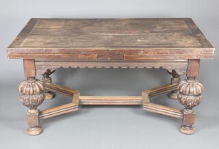 A Victorian early 17th Century style carved oak drawleaf dining table, raised on cup and cover supports with Y framed stretcher 80cm h x 158cm w x 99cm when closed x 294cm when fully extended 