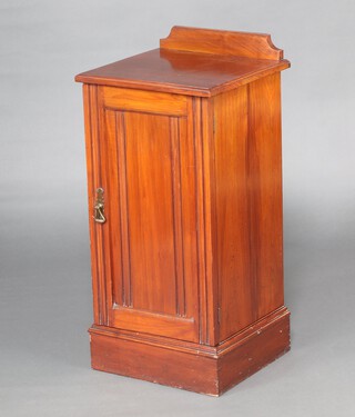 A Victorian mahogany pot cupboard with raised back enclosed by panelled door, raised on a platform base 83cm h x 39cm w x 37cm d 