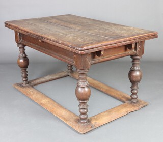 A Dutch 17th Century bleached oak draw leaf dining table, raised on ball turned supports with box framed stretcher to the base 73cm h x 142cm l when closed x 249cm l when fully extended x 87cm w 