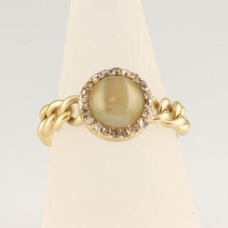 A yellow gold testing as 9ct chain ring with hardstone and diamond cluster mount, the 20 mine cut diamonds each approx. 0.01ct, 6.6 grams, size S 