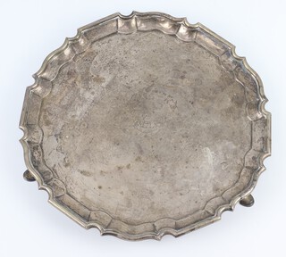 An Edwardian silver salver with Chippendale rim and engraved armorial London 1909 26cm, 576 grams 