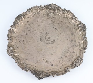 A silver salver with shell and scroll rim and engraved armorial Sheffield 1914, 26cm, 572 grams 